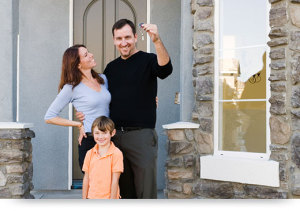 smiling family with house keys
