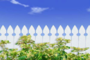 Blue sky with white fence