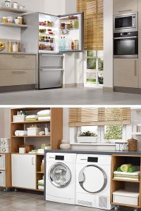 Kitchen with open fridge and tidy laundry room